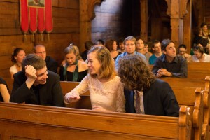 Image of people in wooden church
